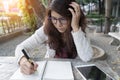 Young woman concentrate reading book. girl learning writing home