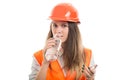 Young woman constructor drinking water