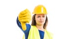 Young woman constructor showing thumb down