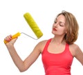 Young woman contractor worker with construction paint brush roll Royalty Free Stock Photo