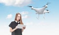 Young woman controlling a drone Royalty Free Stock Photo