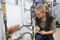 Young woman controlling water level