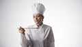 Young woman cook in cook clothes, close-up Royalty Free Stock Photo