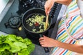 Young woman cooking in her modern kitchen Royalty Free Stock Photo