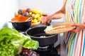 Young woman cooking in her modern kitchen Royalty Free Stock Photo