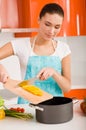 Young woman cooking in the kitchen Royalty Free Stock Photo