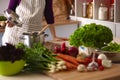 Young Woman Cooking in the kitchen. Healthy Food Royalty Free Stock Photo