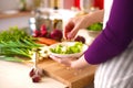 Young Woman Cooking in the kitchen. Healthy Food Royalty Free Stock Photo