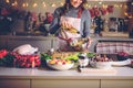 Young Woman Cooking in the kitchen. Healthy Food for Christmas stuffed duck or Goose Royalty Free Stock Photo