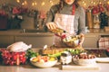 Young Woman Cooking in the kitchen. Healthy Food for Christmas stuffed duck or Goose Royalty Free Stock Photo