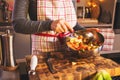 Young Woman Cooking in the kitchen. Healthy Food for Christmas stuffed duck or Goose Royalty Free Stock Photo