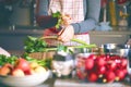 Young Woman Cooking in the kitchen. Healthy Food for Christmas stuffed duck or Goose Royalty Free Stock Photo