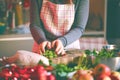 Young Woman Cooking in the kitchen. Healthy Food for Christmas stuffed duck or Goose Royalty Free Stock Photo