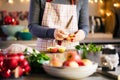 Young Woman Cooking in the kitchen. Healthy Food for Christmas stuffed duck or Goose Royalty Free Stock Photo