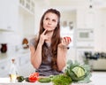 Young Woman Cooking in the kitchen. Healthy Food - Royalty Free Stock Photo
