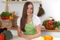 Young woman cooking in kitchen. Householding, tasty food and vegetarian in lifestyle concepts Royalty Free Stock Photo