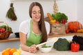 Young woman cooking in kitchen. Householding, tasty food and vegetarian in lifestyle concepts Royalty Free Stock Photo