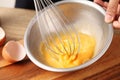 Young woman cooking omelet on table Royalty Free Stock Photo