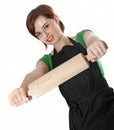 Young woman cooking with a roller Royalty Free Stock Photo