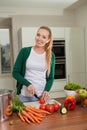 Young woman cooking vegetarian food