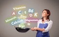 Young woman cooking vitamins and minerals