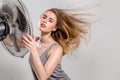 Young woman with cooler fan Royalty Free Stock Photo