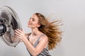 Young woman with cooler fan