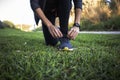 Young woman cordoning her running shoes off for a run sesion outdoors in the park Royalty Free Stock Photo