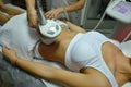 Young woman during cosmetic body treatment