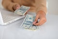 Young woman counting cash dollars for buying Royalty Free Stock Photo