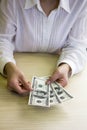 Young woman counting US dollars Royalty Free Stock Photo