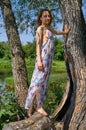 Young woman on countryside background near trees Royalty Free Stock Photo