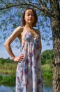 Young woman on countryside background near trees Royalty Free Stock Photo