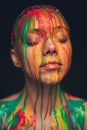 Young woman covered with a colourful paint