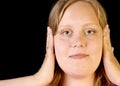 Young woman covering ears Royalty Free Stock Photo