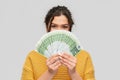 Young woman covering her face with euro money Royalty Free Stock Photo