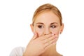 Young woman covering her mouth with hand Royalty Free Stock Photo