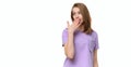 Young woman covering mouth with hand, looking serious, promises to keep secret. Place for your text Royalty Free Stock Photo