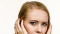 Young woman covers ears with hands. Attitude reaction Royalty Free Stock Photo