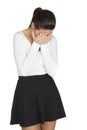 Young woman covers her face with her hands in grief Royalty Free Stock Photo