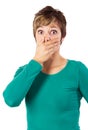 Young woman covers her mouth