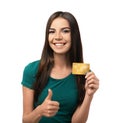 Young woman with credit card showing thumb-up gesture on white background. Online shopping Royalty Free Stock Photo