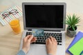 Young woman with credit card using laptop for online food delivery indoors Royalty Free Stock Photo