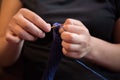 Young woman crocheting blue yarn