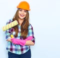 Young woman with crossed arms holding painting roller Royalty Free Stock Photo