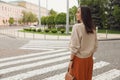 Young woman crossing street. Traffic rules Royalty Free Stock Photo