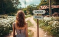 Young woman at a crossroads with a signpost pointing to Choice, symbolizing life decisions, direction, and the uncertainty of Royalty Free Stock Photo