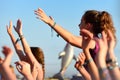 Young woman from the crowd cheering at FIB Festival