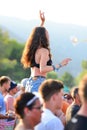 Young woman from the crowd cheering at FIB Festival