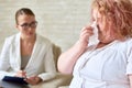 Young Woman Crying in Meeting with Psychiatrist